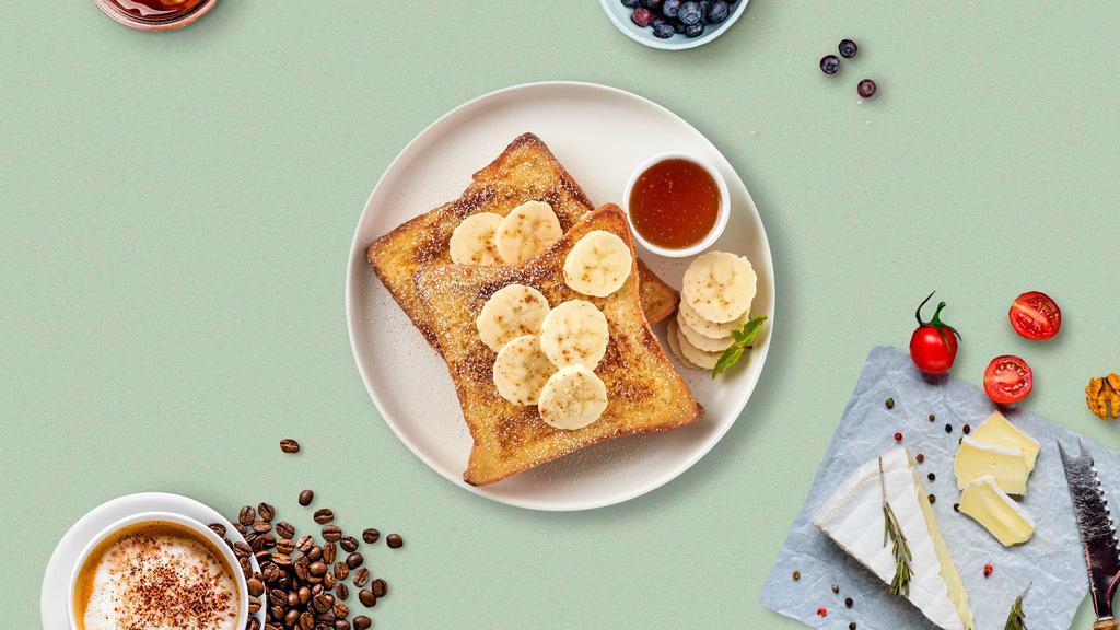 Nutty Banana French Toast · 3 Slices french toast with walnuts and bananas.