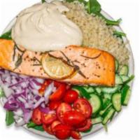 Protein Power Bowl · 518 cal. Spinach, brown rice, cucumber, red onions, cherry tomatoes, hummus, salmon.