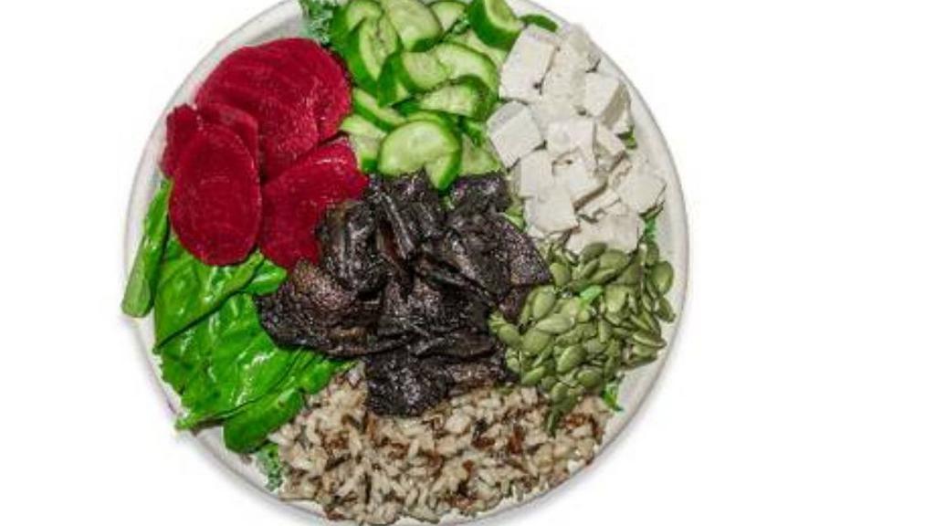 Grandma Bowl · 628 cal. Vegan. Kale, wild rice, basil, cucumber, beets, pumpkin seeds, tofu, portobello mushroom, sesame ginger dressing.