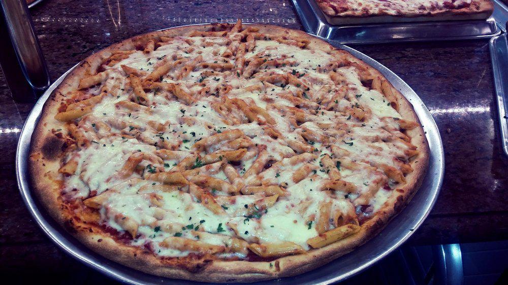 Penne Vodka Pizza · Penne pasta in a vodka sauce pie with mozzarella.