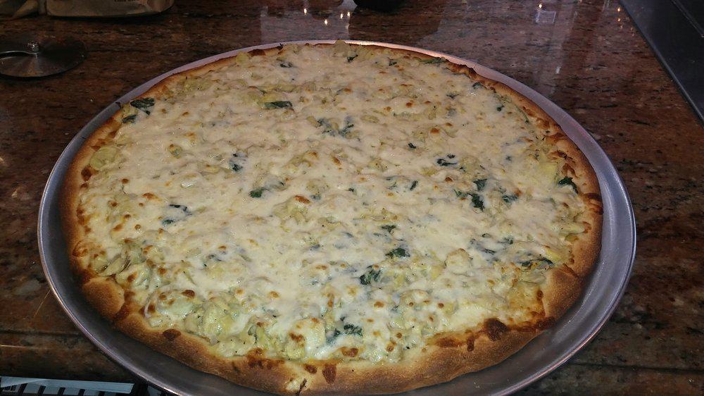 Cream Of Artichoke & Spinach Pizza · Creamy artichoke, spinach and mozzarella pie.
