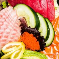 Sashimi Salad · Salmon, tuna, white fish, avocado, green salad, Japanese style soy sauce.