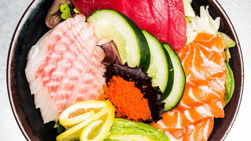 Sashimi Salad · Salmon, tuna, white fish, avocado, green salad, Japanese style soy sauce.