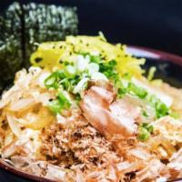 Chicken Donburi · A bowl of rice topped with chicken katsu, onion, egg, pickled radish, scallion, ginger.
