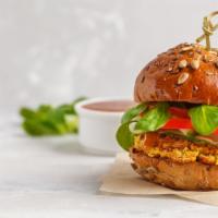 Homemade Veggie Burger · Hearty veggie patty with choice of fixings loaded between toasted buns.