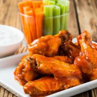Hot & Spicy Buffalo Wings · Five fresh buffalo wings smothered in tangy buffalo sauce and served with creamy Bleu cheese...