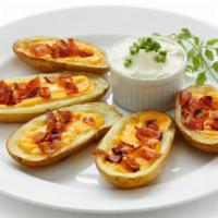 Potato Skins · Hearty potato wedges stuffed with crumbled bacon and creamy Cheddar cheese.