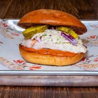 Grilled Sammy · Grilled chicken breast, Choose Heat, Kick'n Pickles, Slaw & Sauce. Served on a Brioche Bun