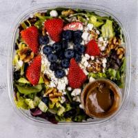 Strawberry Fiesta Salad · Mesculin greens, romaine, goat cheese, strawberries, walnuts and our own homemade balsamic d...