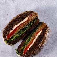 Eggplant Focaccia · Fried eggplant, our own fresh mozzarella, fresh roasted peppers, baby arugula and balsamic g...