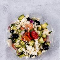 Chopped Greek Salad · Tomatoes, cucumbers, feta cheese, red onions, olive oil and vinegar.