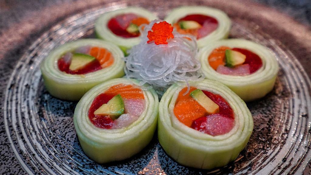 Fusion Trio · Tuna, salmon, yellowtail, and avocado wrapped with cucumber skin served with ponzu sauce.