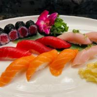 Tri Color Sushi · 3 pieces  yellowtail, 3 pieces salmon, 3 pieces tuna, and a tuna roll.