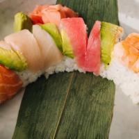 Rainbow Roll · Inside - crabmeat, avocado, and cucumber, outside - tuna, salmon, yellowtail, shrimp and avo...