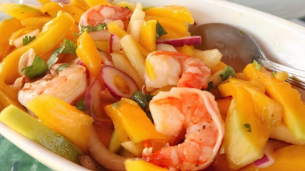 Mango Shrimp · Spicy. Shredded mango with green and red pepper, sweet peas cooked in spicy mango sauce.