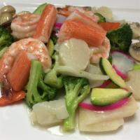 Seafood Delight · Served with rice. Scallops, jumbo shrimp, kani, fish cake, sautéed with assorted Chinese veg...