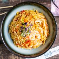 Jue Lan Special Rice · Served with lobster, shrimp, chicken, and pineapple. Our favorite.
