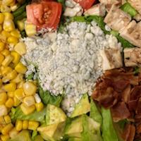 Cobb Salad · Romaine with Chicken, Corn, Bacon, Crumbled Blue Cheese, Tomatoes & Avocado