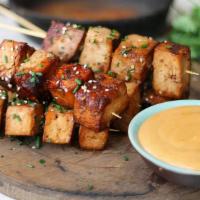 Satay Tofu With Peanut Sauce · Crispy tofu stuffed with cucumber, bean and sprouts served with spicy peanut sauce.