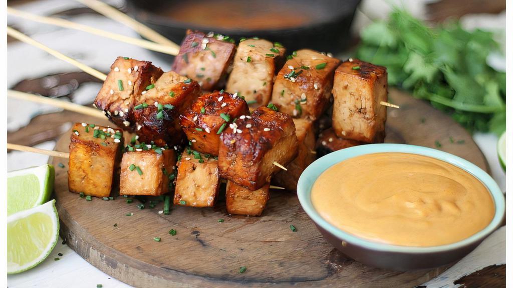 Satay Tofu With Peanut Sauce · Crispy tofu stuffed with cucumber, bean and sprouts served with spicy peanut sauce.