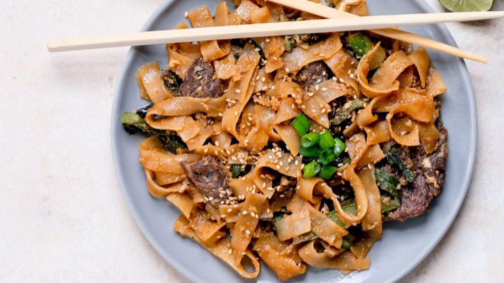 Pad See Ew · Savory and balanced with a touch of sour and bold chargrilled flavor. Wok-fried flat noodles made with egg, soy sauce, and Chinese broccoli.