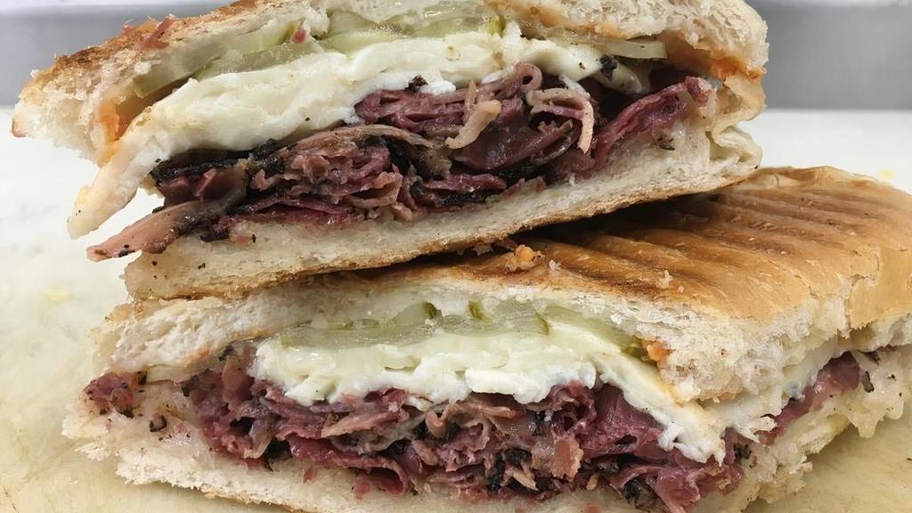 Ricky Special Sandwich · FRESH SLICED LEAN PASTRAMI W/ MELTED FRESH MOZZ TOPPED WITH PICKLES AND SRIRACHA SAUCE ON A HERO