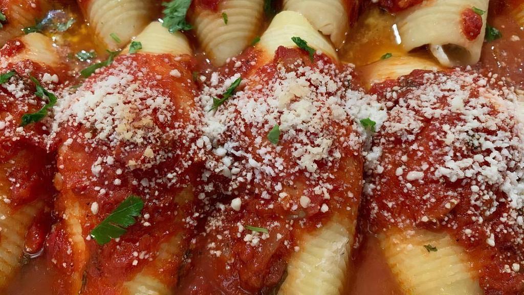 Stuffed Shells · A DELICIOUS DISH OF SHELLS STUFFED W/RICOTTA CHEESE & SMOTHERED W/OUR HOMEMADE ZESTY MARINARA SAUCE. 