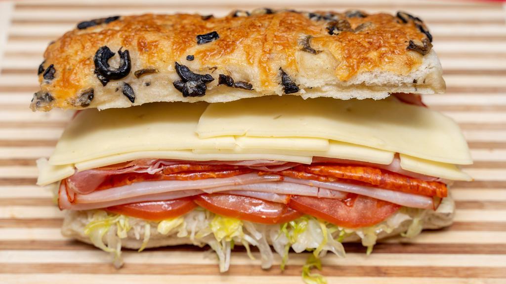 Italian Sub Sandwich · Prosciutto, salami, pepperoni, provolone cheese, lettuce, tomato, onion, olive oil, and vinegar.