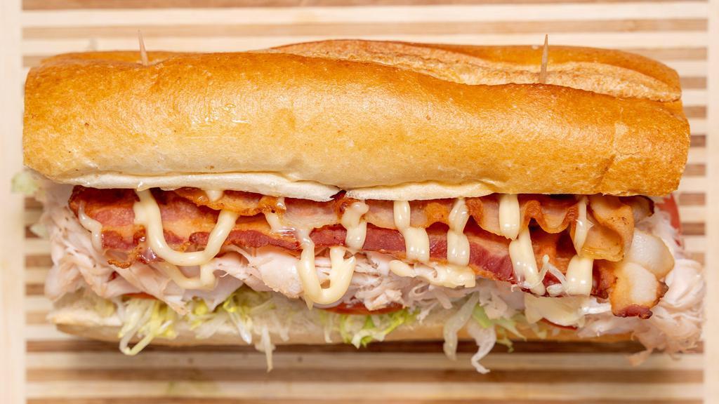 Turkey Club Sandwich · Turkey, bacon, lettuce, tomato, and mayo.