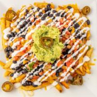 Loaded Fries · Old bay-fries topped with black beans, melted jack, and cheddar cheese, pickled jalapenos, c...