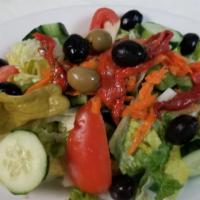 House Salad · A mixture of fresh seasonal greens. salad black olives green peppers pepperoncini cucumbers ...