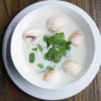 Tom Kha Soup · Coconut based soup with mushrooms seasoned with aromatic galangal, lime juice and cilantro.