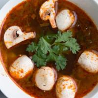 Tom Yum Soup · A savory spicy and sour soup seasoned with exotic Thai herbs, mushrooms, lemongrass kaffir l...
