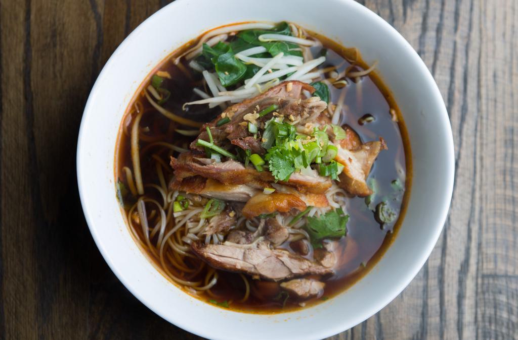 Duck Noodle Soup · Thin rice noddle in dark broth, Chinese broccoli, bean sprout, celery, scallion, cilantro and garlic.