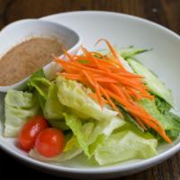 Green Salad · Lettuce, carrot, tomato, cucumber and romaine with homemade dressing.