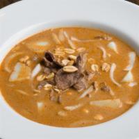 Massaman Curry · Choice of meat with massaman curry paste with potatoes, carrot, onion in creamy coconut milk...
