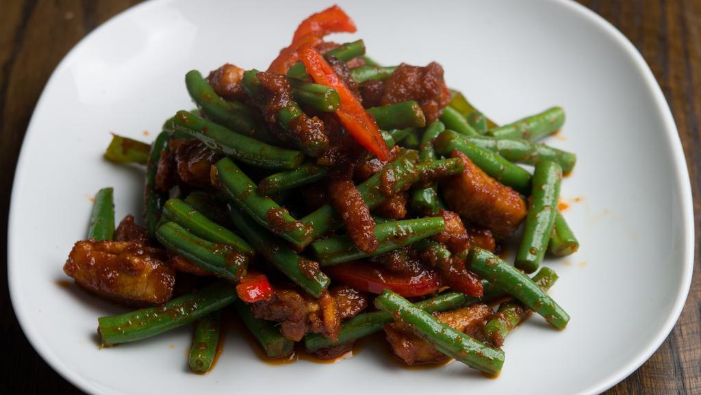 Prik King · Sauteed with garlic, chili paste, green bean, carrot and bell pepper in homemade sauce. Served with rice. Spicy.