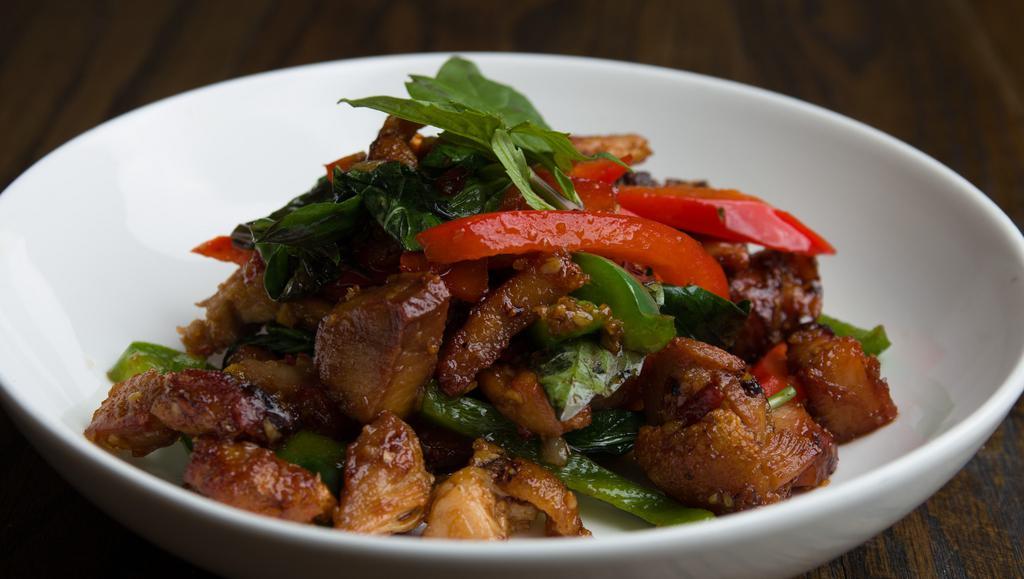 Crispy Pork Basil · Sauteed fried crispy pork with chili, onion, green bean, basil, bell pepper in special homemade sauce served with steam jasmine rice. Spicy.