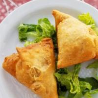 Vegetable Samosa · Spicy. Lightly spiced potato and peas filling.