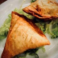 Meat Samosa · Spicy. Spiced minced lamb and peas filling.
