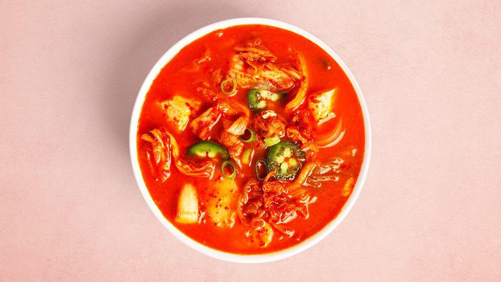 Kimchi Stew · Rich stew made with kimchi, scallions, onions, and diced tofu.