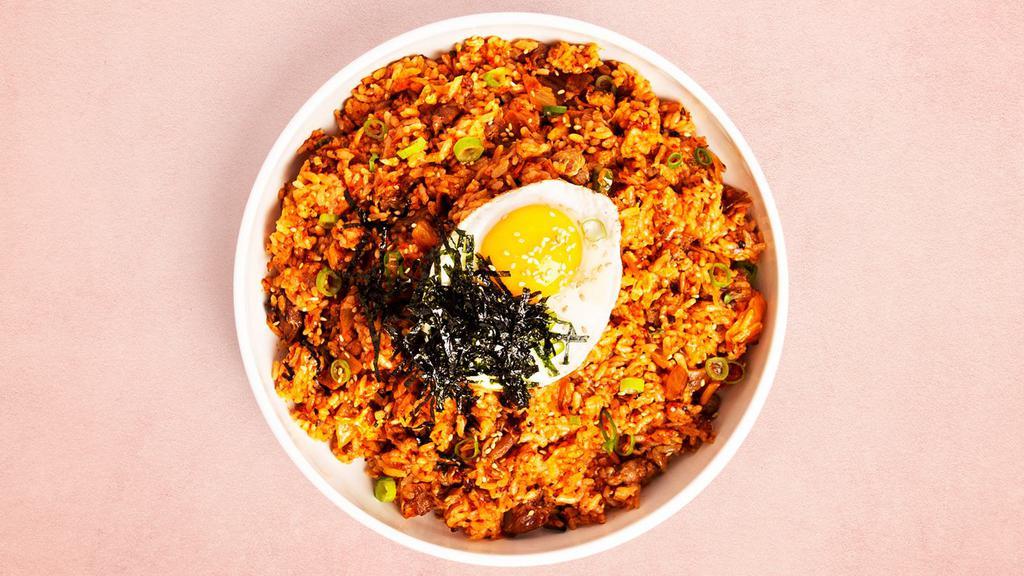 Kimchi Fried Rice · Fried rice with kimchi, a fried egg, and your choice of protein.