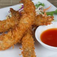 Coconut Shrimp · Jumbo white shrimp battered with shoved coconut and served with sweet chili sauce.