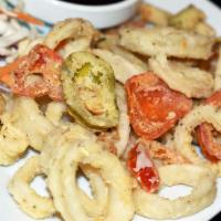 Crispy Calamari · Flash fried fresh calamari tossed with  cherry peppers and vegetables in a  teriyaki sauce.