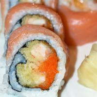 Smokey · Shrimp tempura, spicy mayo, masago & scallion topped with a fresh cut of smoked salmon.
