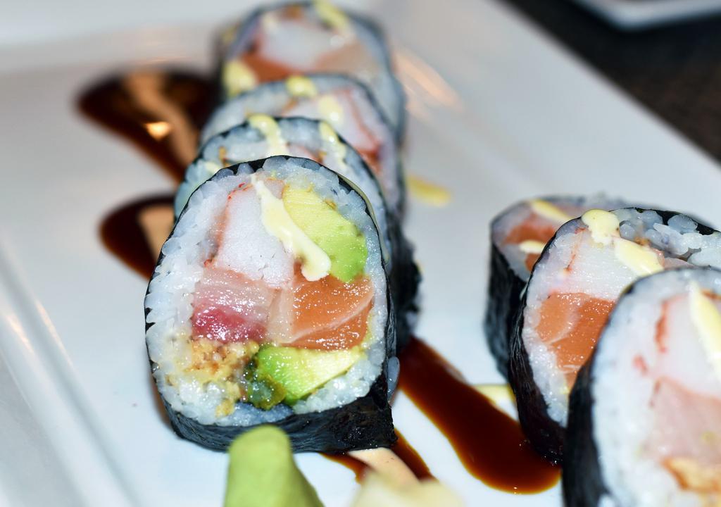 Angel Kiss · Yellowtail, salmon, eel, crabmeat, avocado and pickled squash topped with spicy mayo and eel sauce.