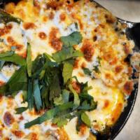 Queso Fundido · Melty chihauhua cheese with house made chorizo and roasted poblanos. Served with 4 warm tort...