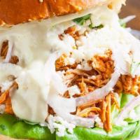 Pollo Torta · Shredded amish chipotle chicken, black bean spread, roasted serrano relish, bibb lettuce, re...