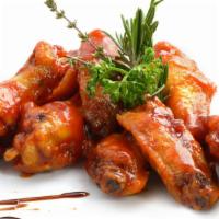 Bbq Wings - Bone-In · Classic bone-in wings oven-baked, topped with BBQ sauce, cooked to order and perfectly crisp.