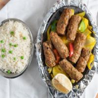 Chicken Kebab · Ground chicken prepared with green peppers, onions, and herbs. Served with rice.